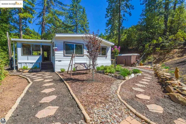 a backyard of a house with lots of green space