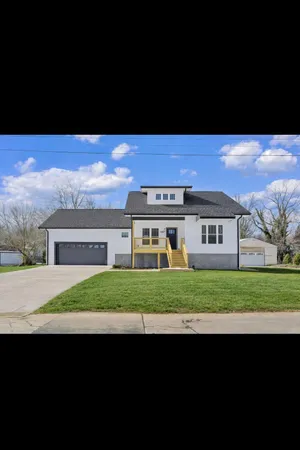 a house view with a garden space