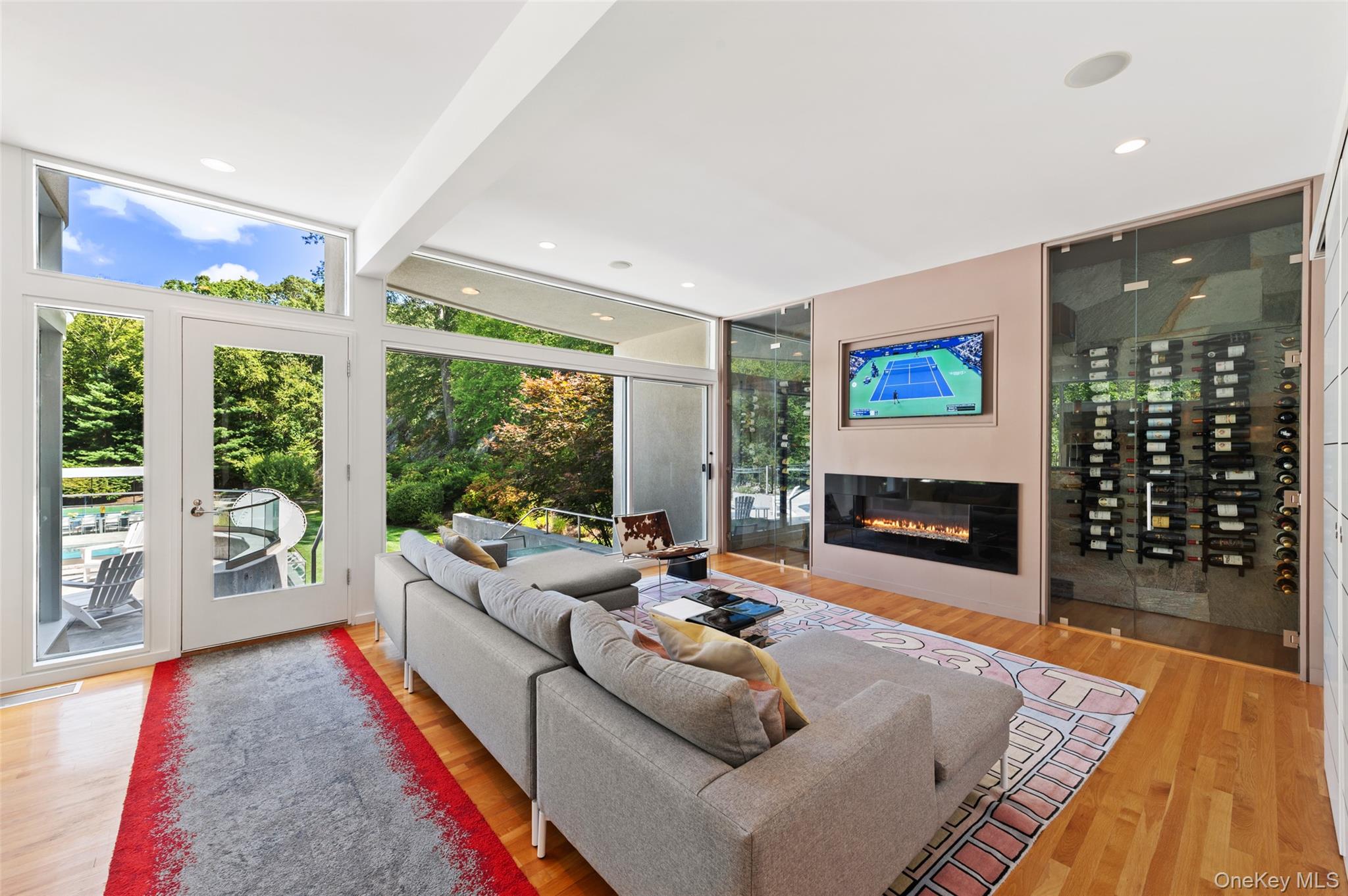 25 Col Sheldon Lane Pound Ridge, NY 10576 - Photo 14 of 34 a living room with furniture and a flat screen tv