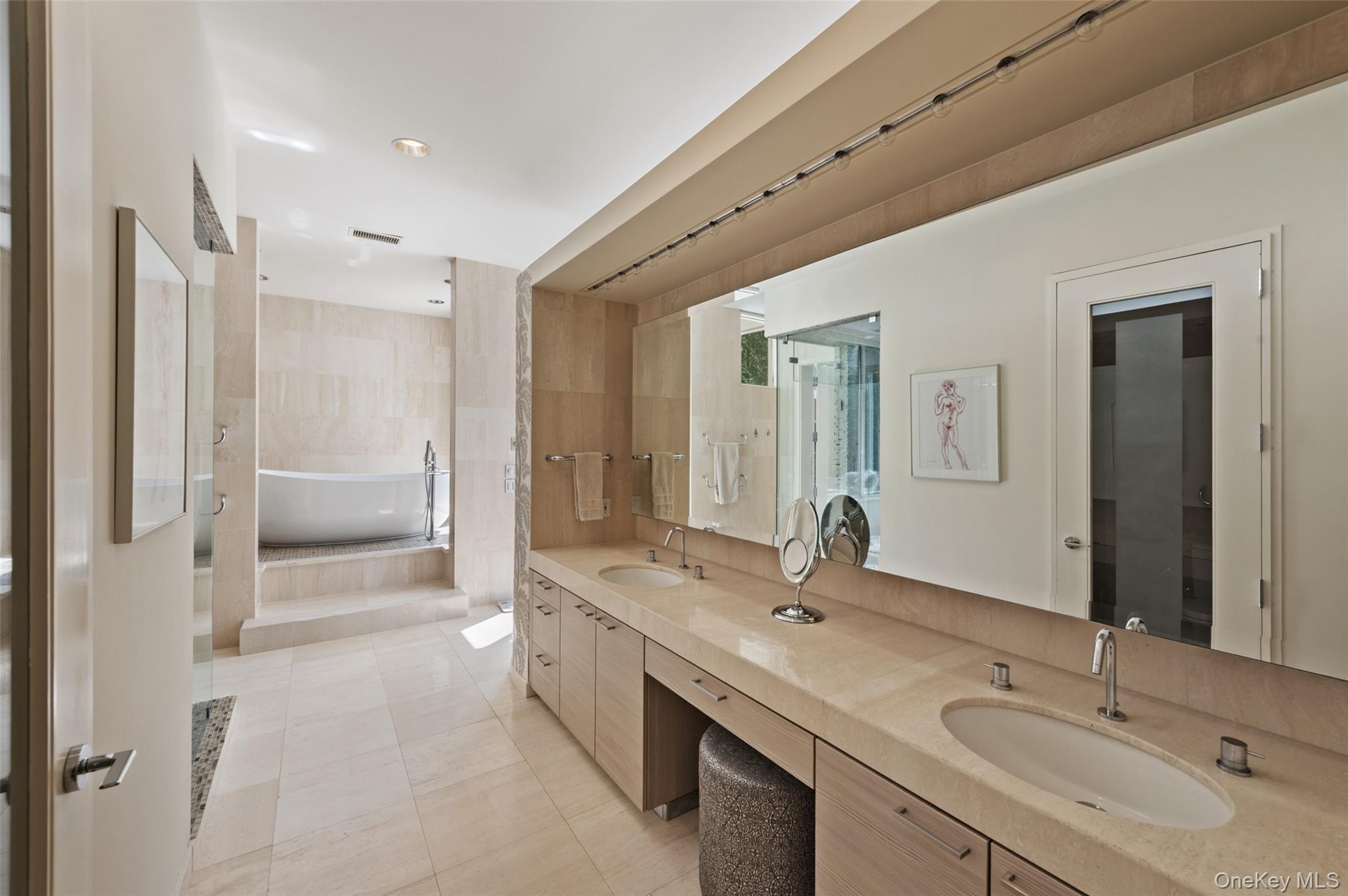 25 Col Sheldon Lane Pound Ridge, NY 10576 - Photo 19 of 34 a bathroom with a double vanity sink a and mirror