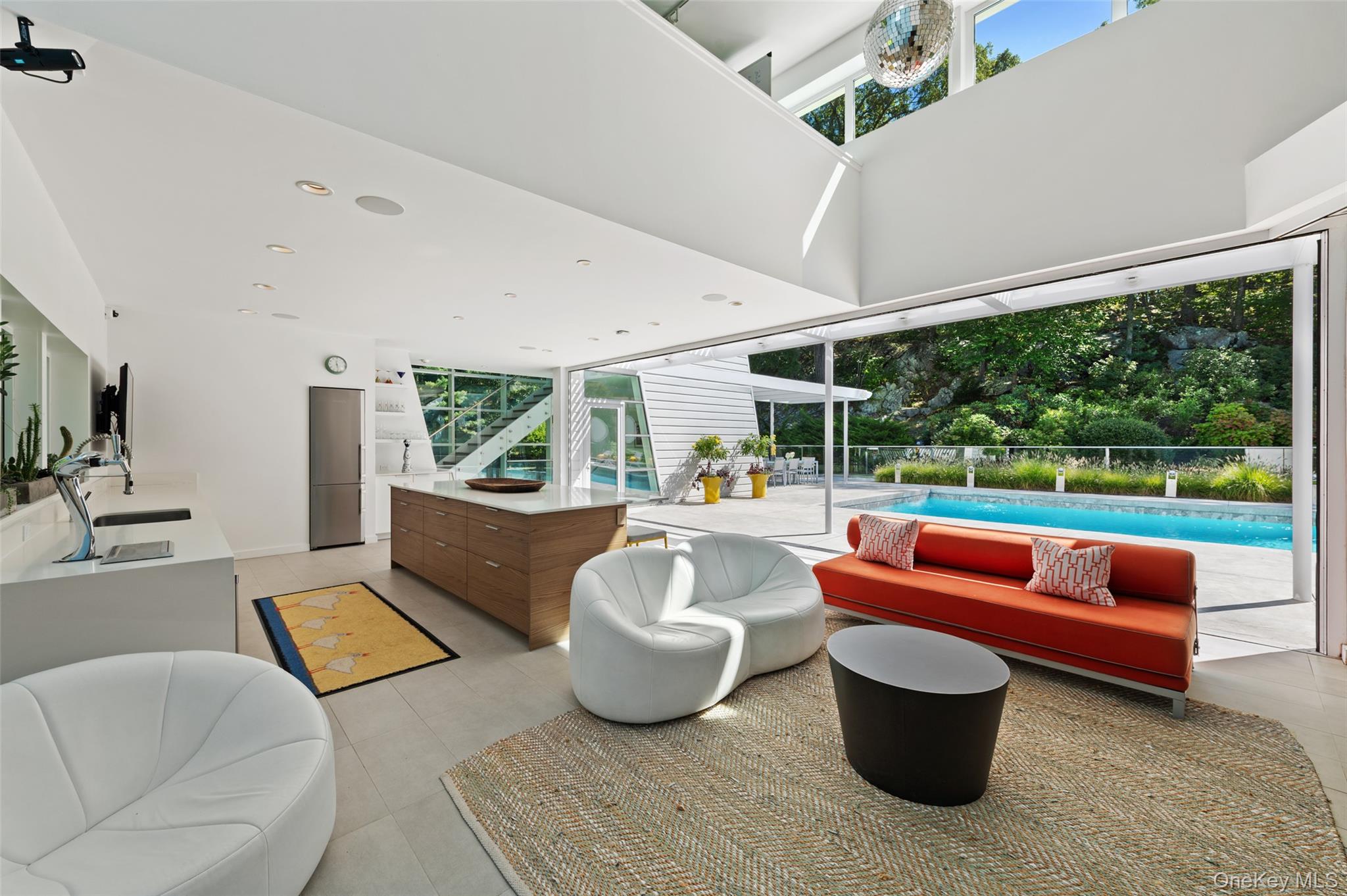 25 Col Sheldon Lane Pound Ridge, NY 10576 - Photo 29 of 34 a living room with patio furniture and a potted plant