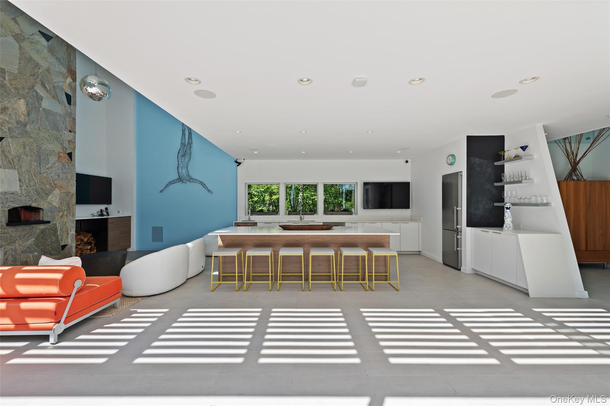 25 Col Sheldon Lane Pound Ridge, NY 10576 - Photo 31 of 34 a living room with furniture a flat screen tv and a rug