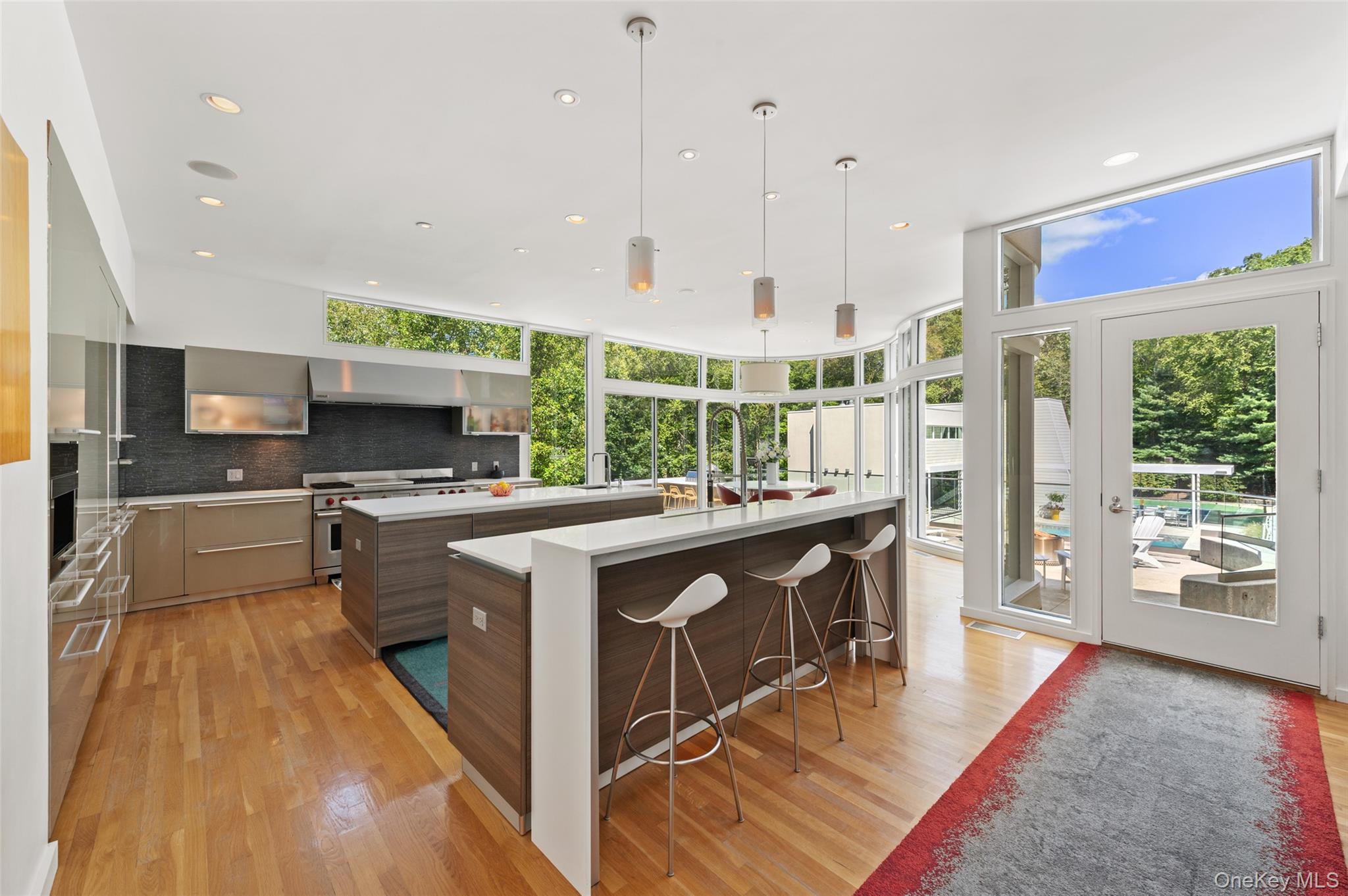 25 Col Sheldon Lane Pound Ridge, NY 10576 - Photo 10 of 34 a kitchen with stainless steel appliances granite countertop a stove a sink and a refrigerator