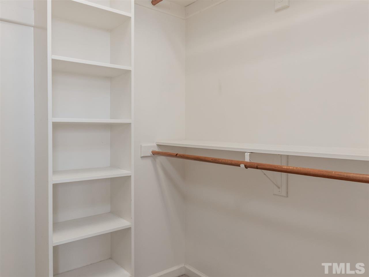 2864 Anfield Road Raleigh, NC 27606 - Photo 14 of 30 Walk in closet with wood shelving.