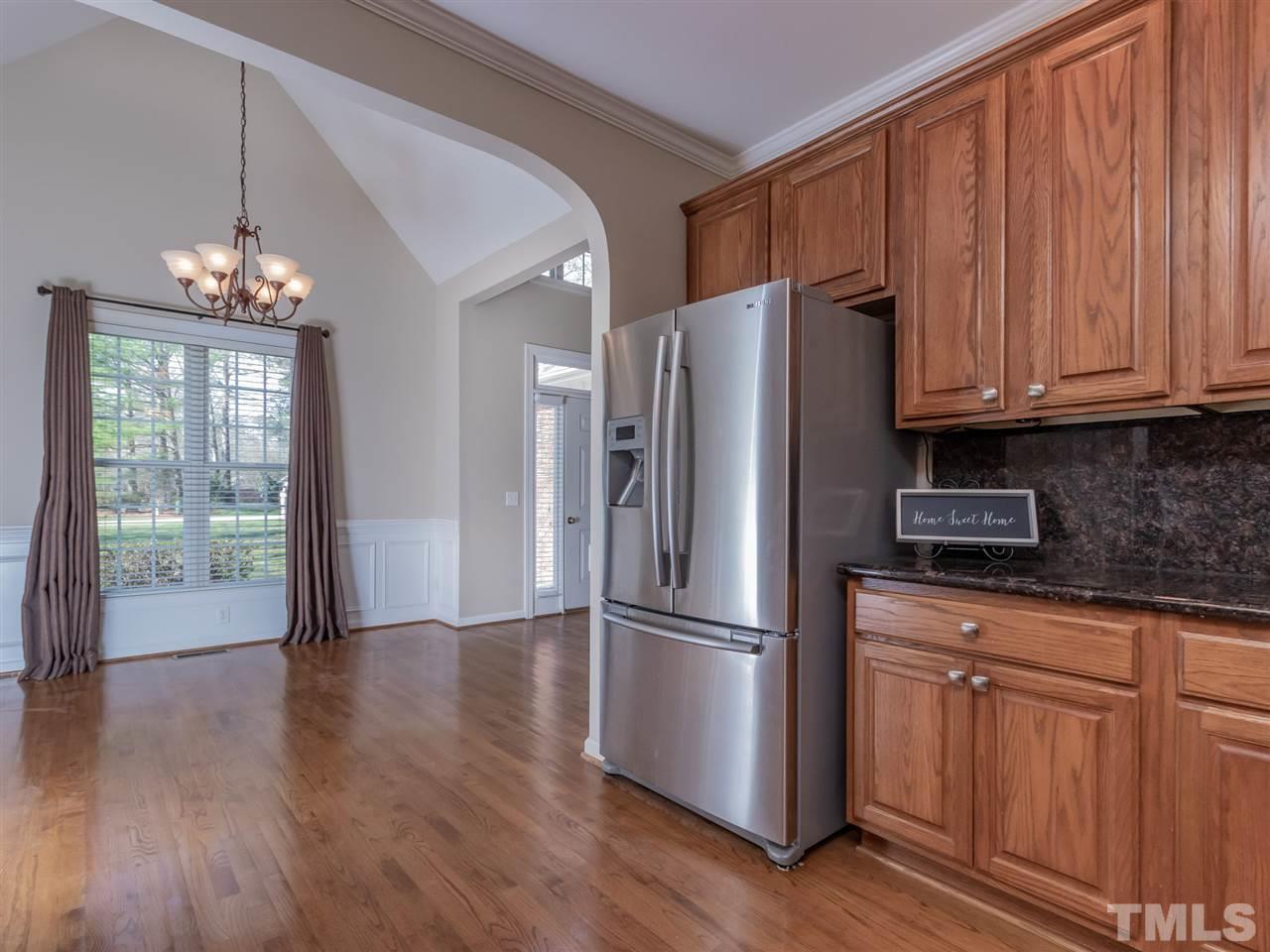 2864 Anfield Road Raleigh, NC 27606 - Photo 5 of 30 Large kitchen with abundant cabinets, pull outs, Stainless steel refrigerator conveys and granite counters!