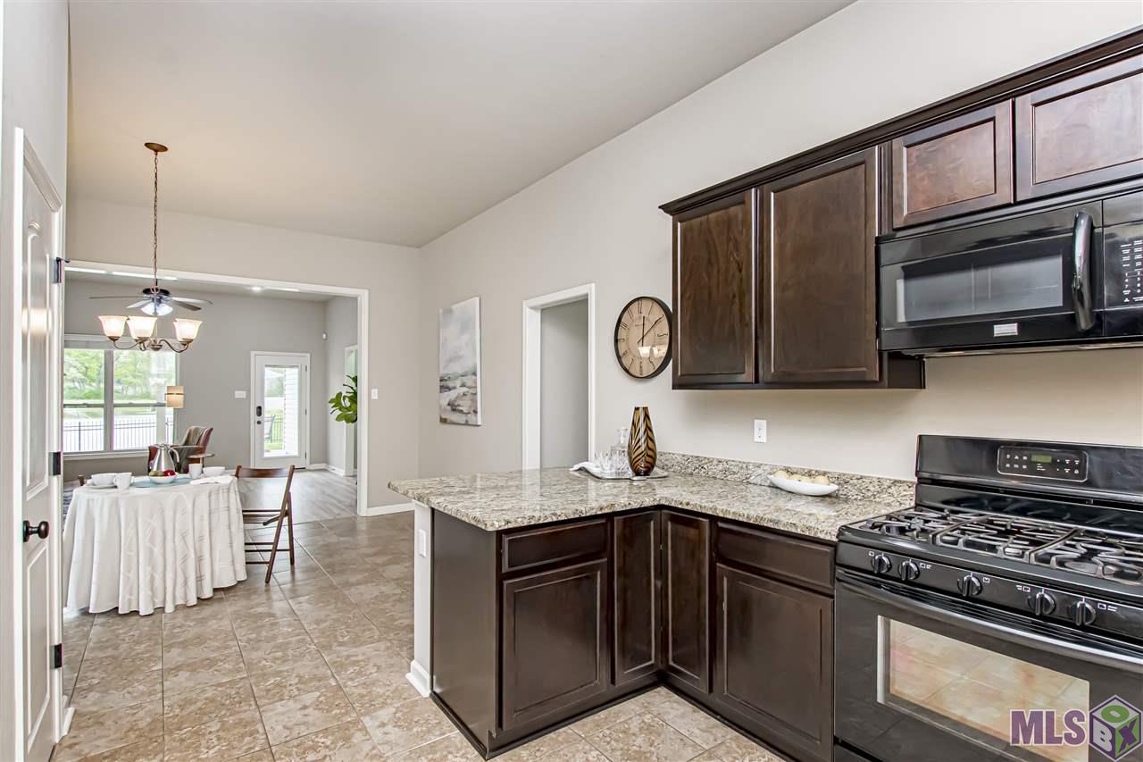 8681 Summer Grove Avenue Baton Rouge, LA 70820 - Photo 14 of 32 Spacious Kitchen w/Breakfast Bar