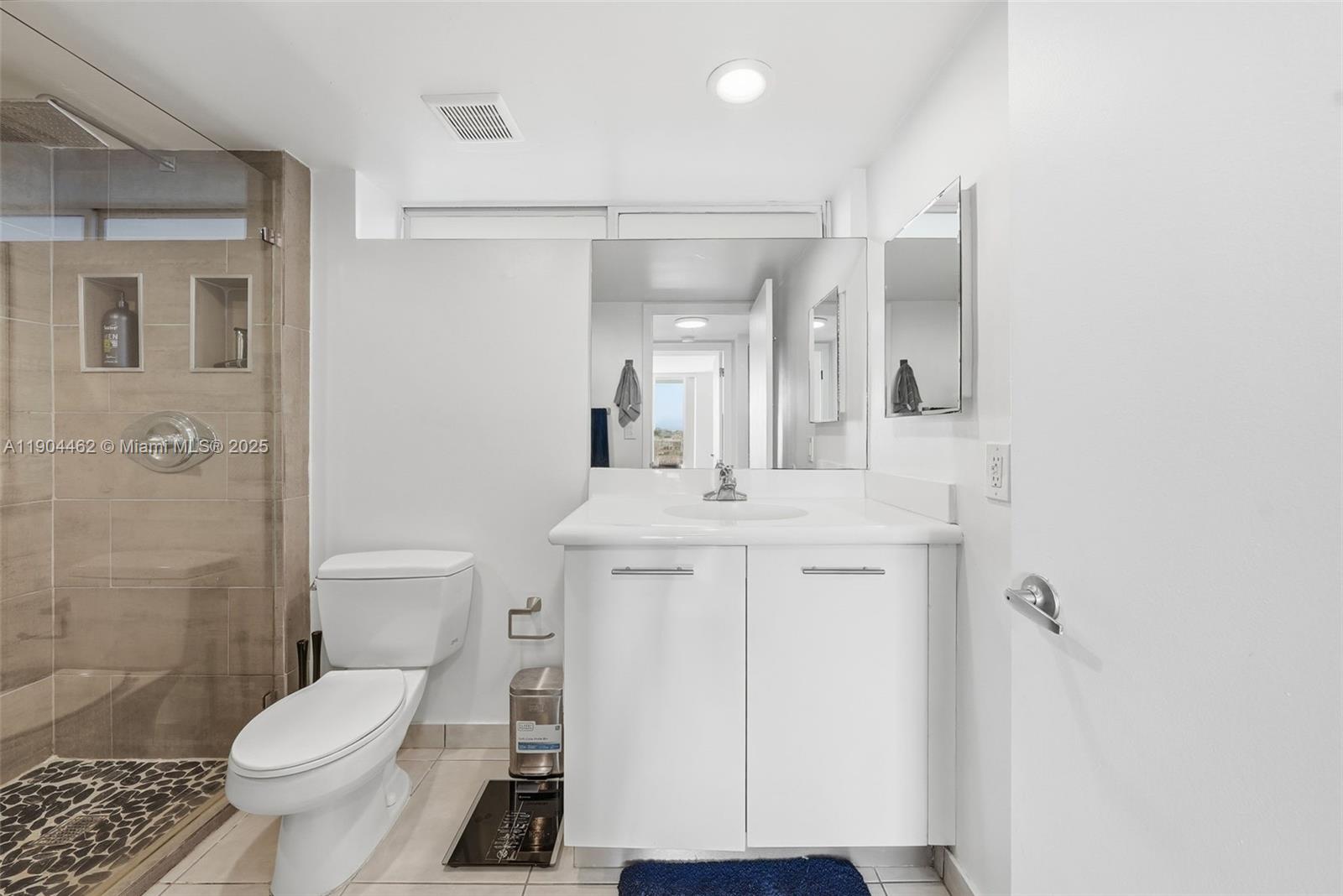 700 Northeast 63rd Street, Unit D607 Miami, FL 33138 - Photo 13 of 29 a bathroom with a sink toilet vanity and shower