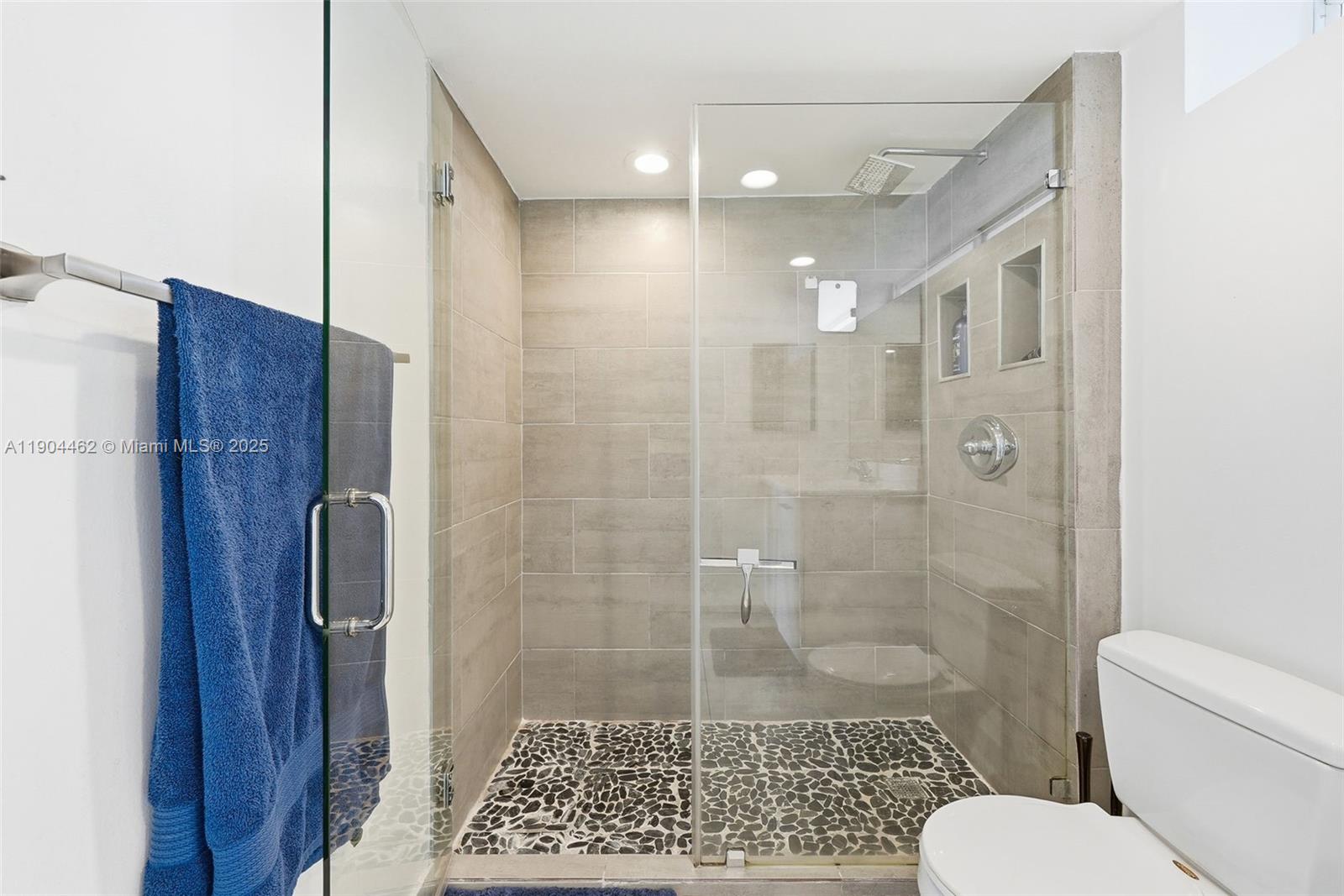 700 Northeast 63rd Street, Unit D607 Miami, FL 33138 - Photo 14 of 29 a bathroom with a shower and a toilet