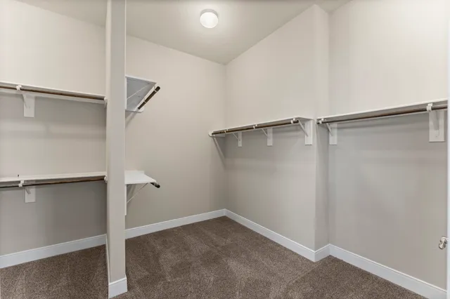 a view of an empty walk in closet