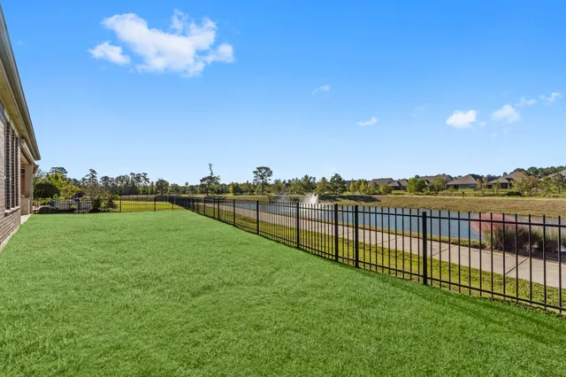 a view of a green field with clear sky