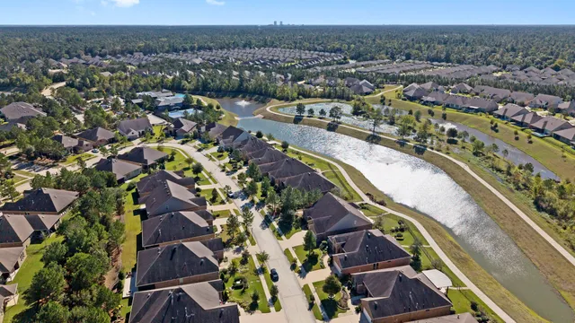 an aerial view of a house with swimming pool