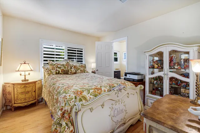 a bedroom with a bed and a bookshelf