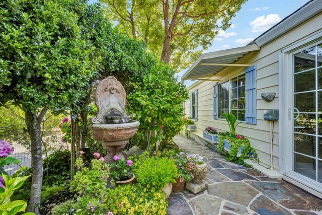 a front view of a house with garden