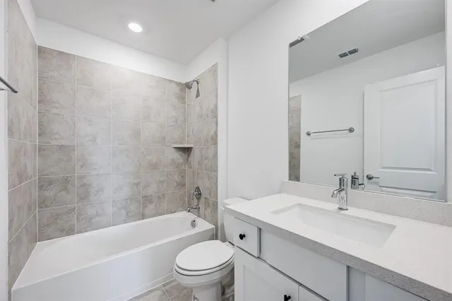 a bathroom with a sink a toilet and a bathtub