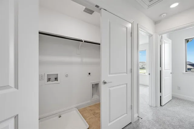 a bathroom with a shower and a glass door