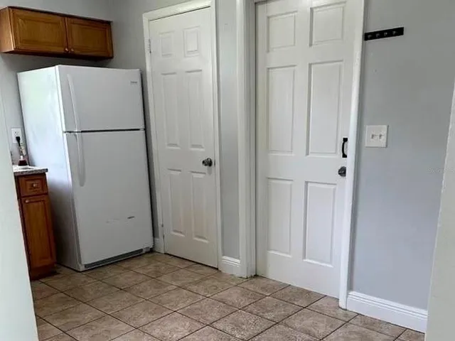 a view of a room with tiles and windows