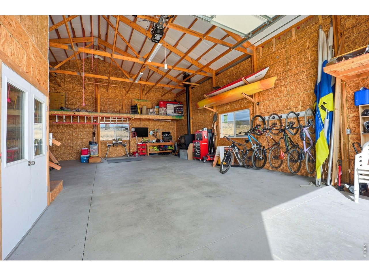 10320 Miners Lake Road Fort Collins, CO 80524 - Photo 30 of 44 Huge insulated outbuilding #2, with oversized garage door and second-level storage