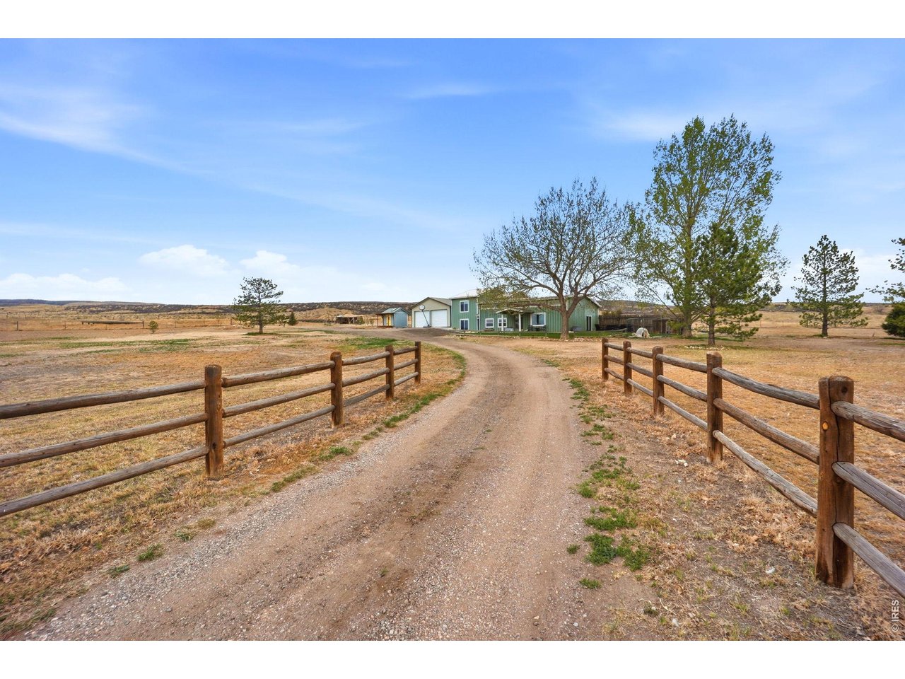 10320 Miners Lake Road Fort Collins, CO 80524 - Photo 4 of 44 Beautiful entrance, with a fence-lined private road