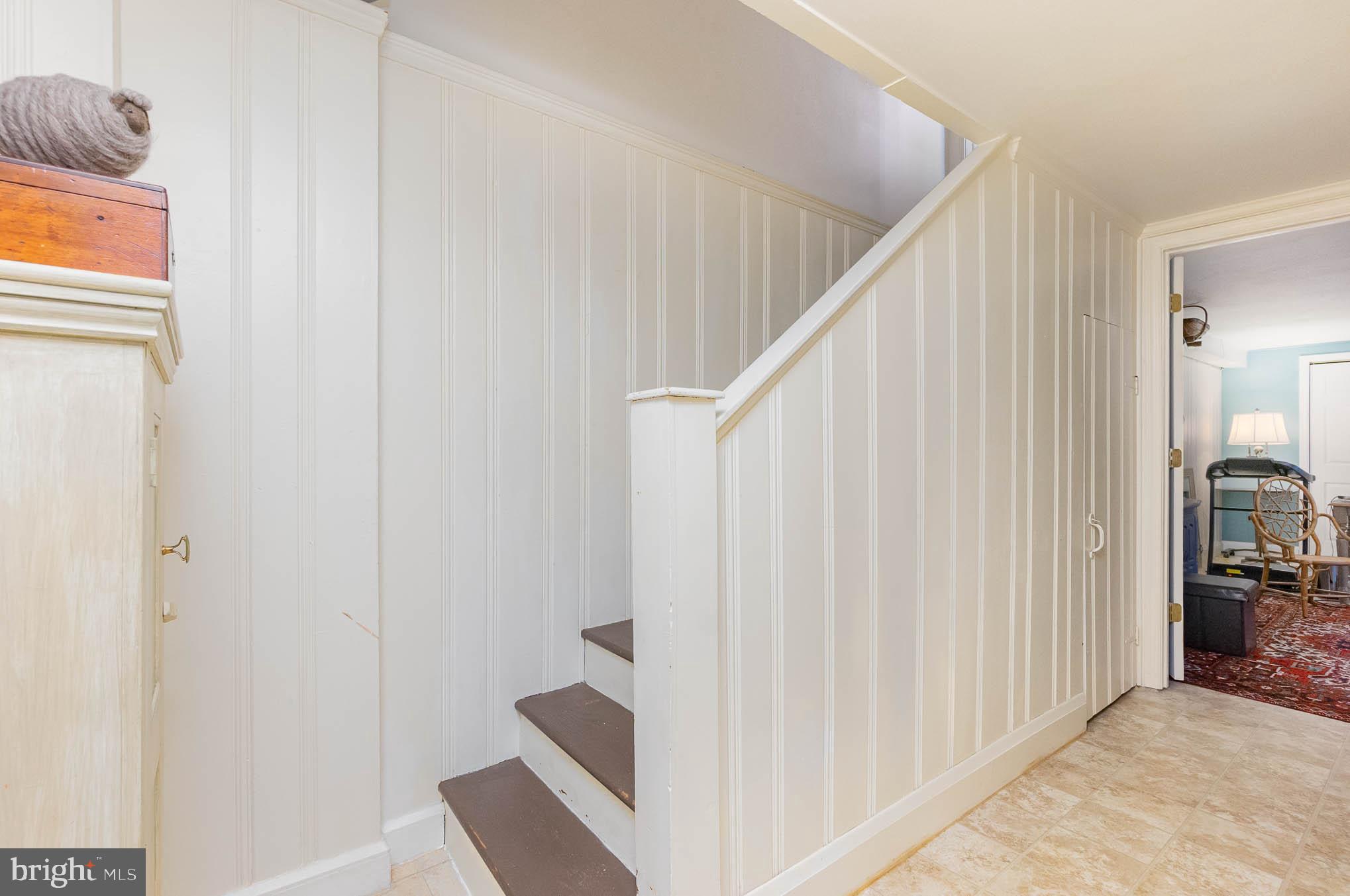 4032 Deepwood Road Baltimore, MD 21218 - Photo 22 of 31 a view of staircase with white walls and a window