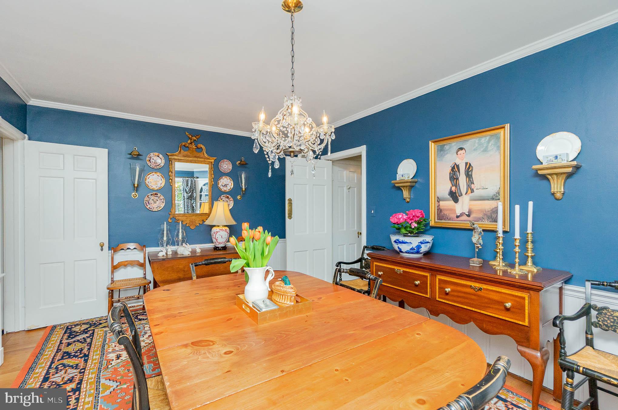 4032 Deepwood Road Baltimore, MD 21218 - Photo 6 of 31 a dining room with furniture and a chandelier