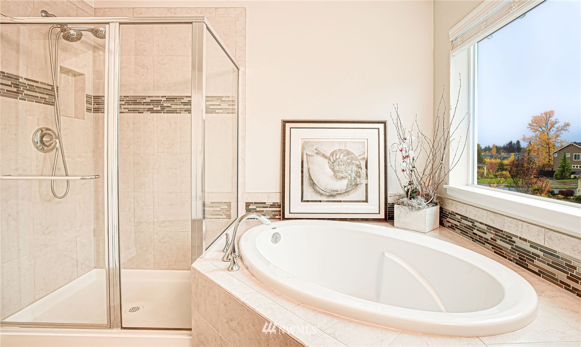 4025 181st Place Southeast Bothell, WA 98012 - Photo 11 of 26 a white bath tub sitting next to a window