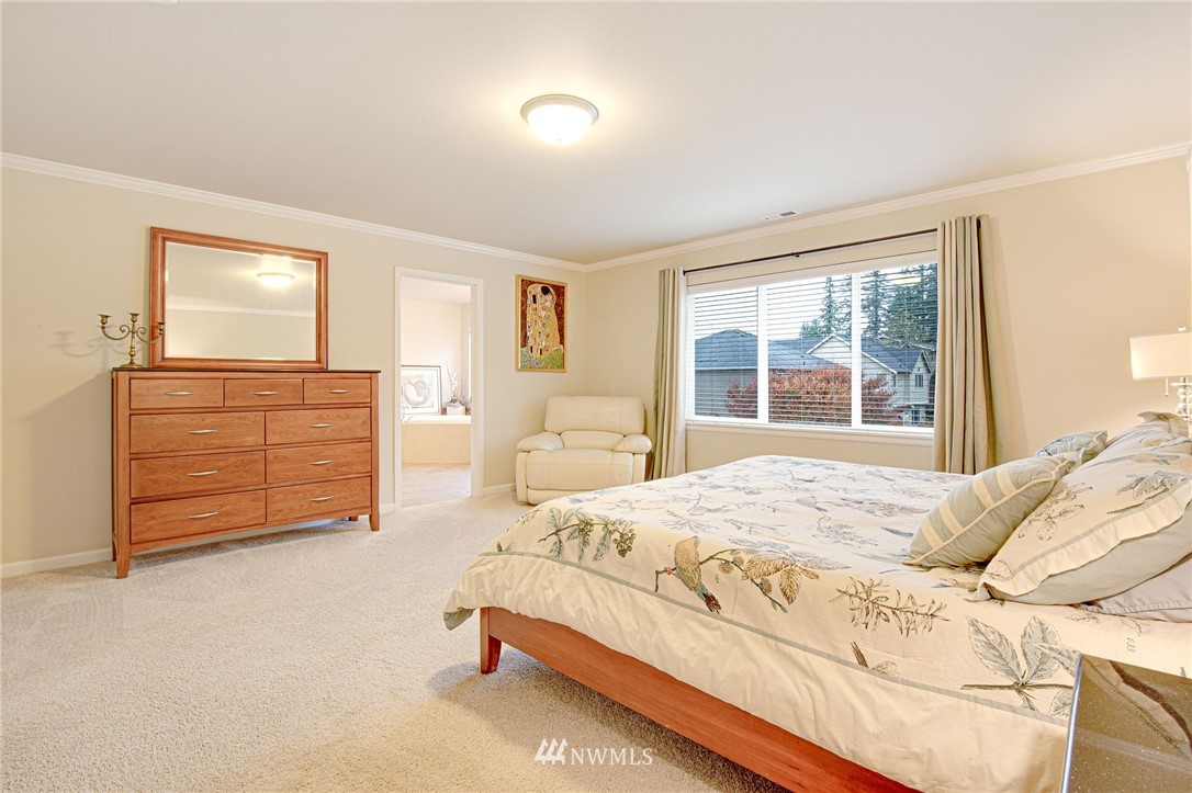 4025 181st Place Southeast Bothell, WA 98012 - Photo 13 of 26 a bedroom with a bed and a dresser