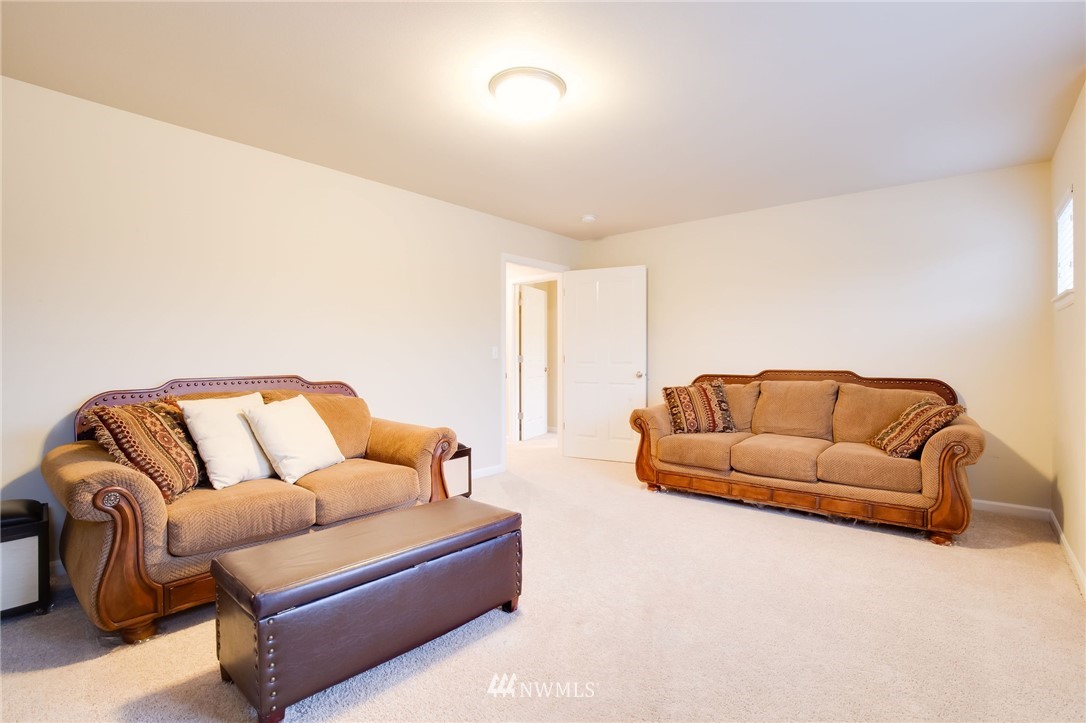 4025 181st Place Southeast Bothell, WA 98012 - Photo 15 of 26 a living room with furniture and a couch