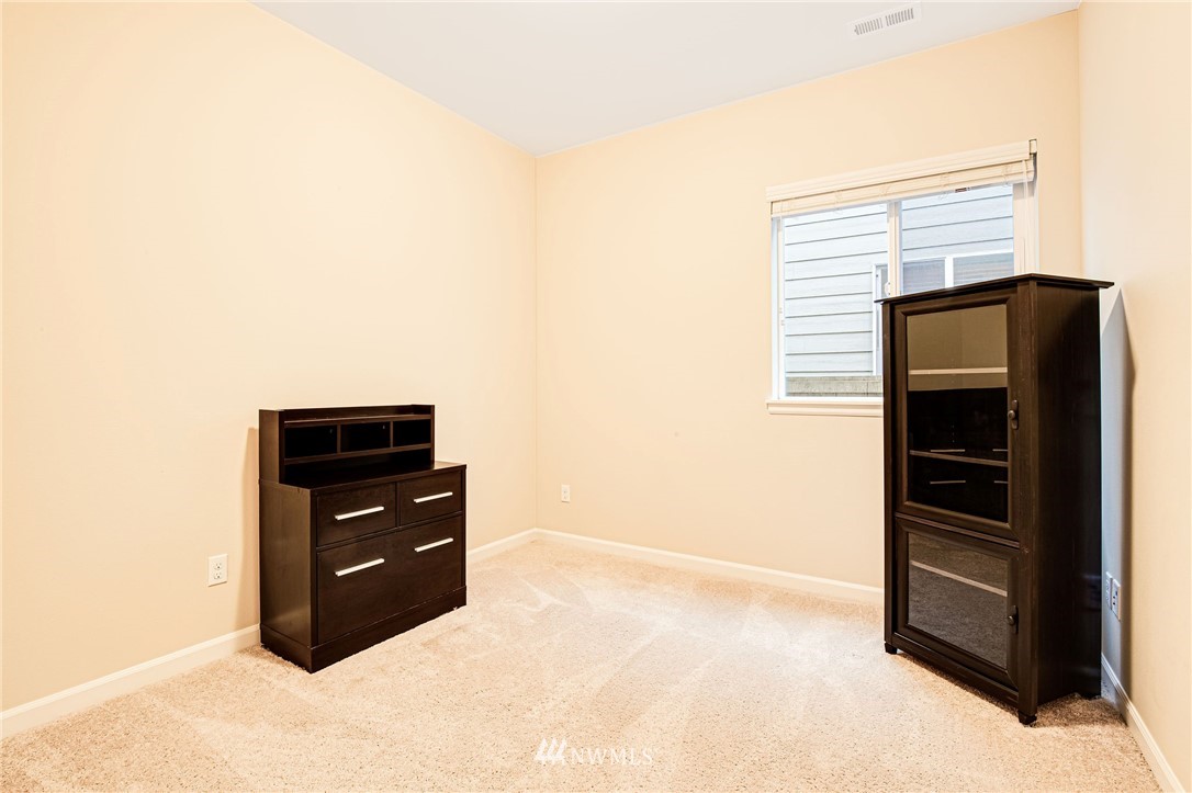 4025 181st Place Southeast Bothell, WA 98012 - Photo 20 of 26 a room with cabinets and a bench