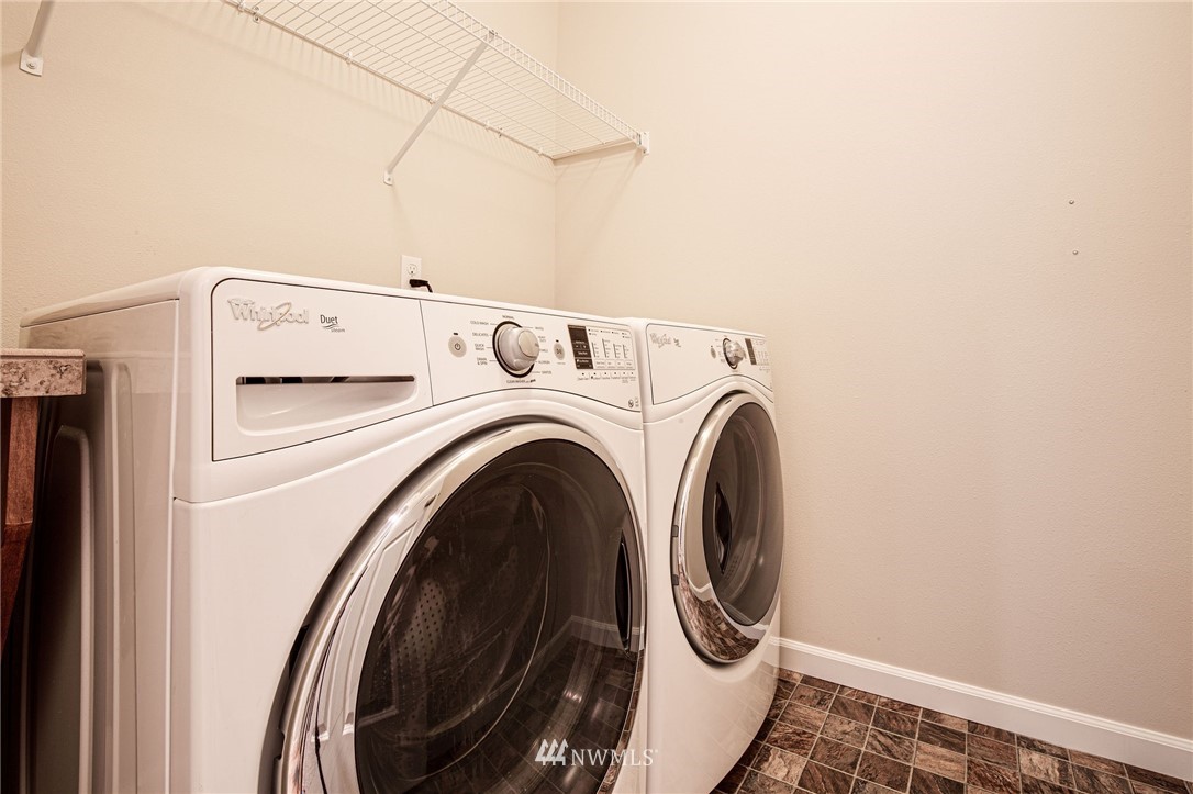 4025 181st Place Southeast Bothell, WA 98012 - Photo 23 of 26 a utility room with dryer and washer