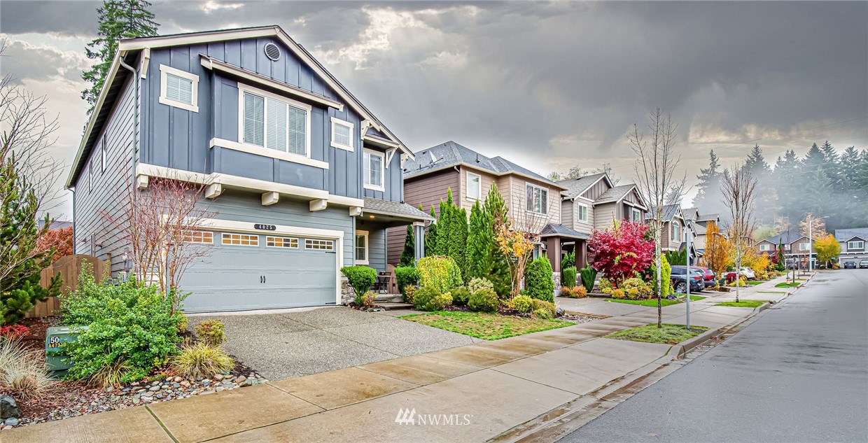 4025 181st Place Southeast Bothell, WA 98012 - Photo 24 of 26 a view of street with small shops