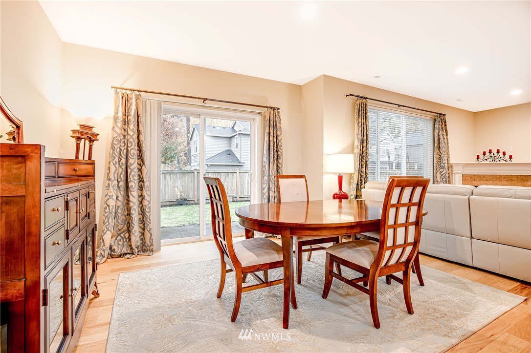 4025 181st Place Southeast Bothell, WA 98012 - Photo 6 of 26 a dining room with furniture and wooden floor