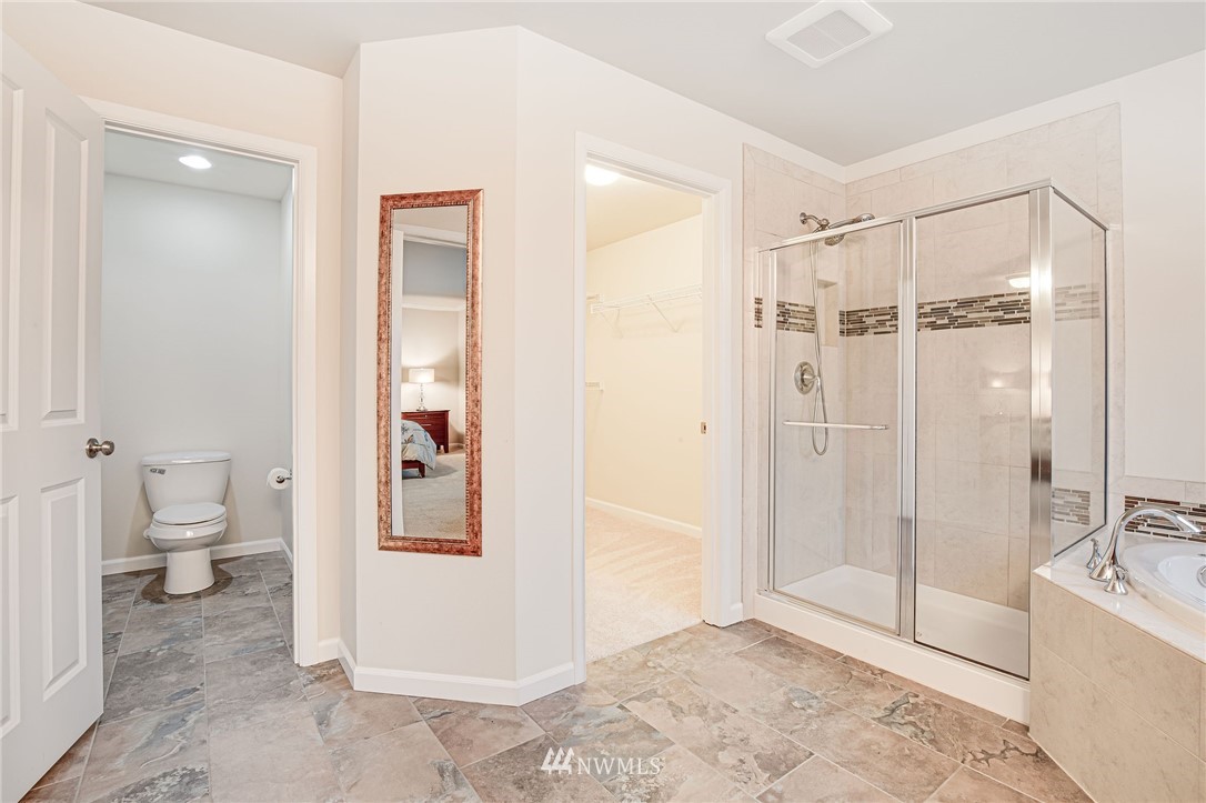 4025 181st Place Southeast Bothell, WA 98012 - Photo 10 of 26 a bathroom with a shower and a toilet