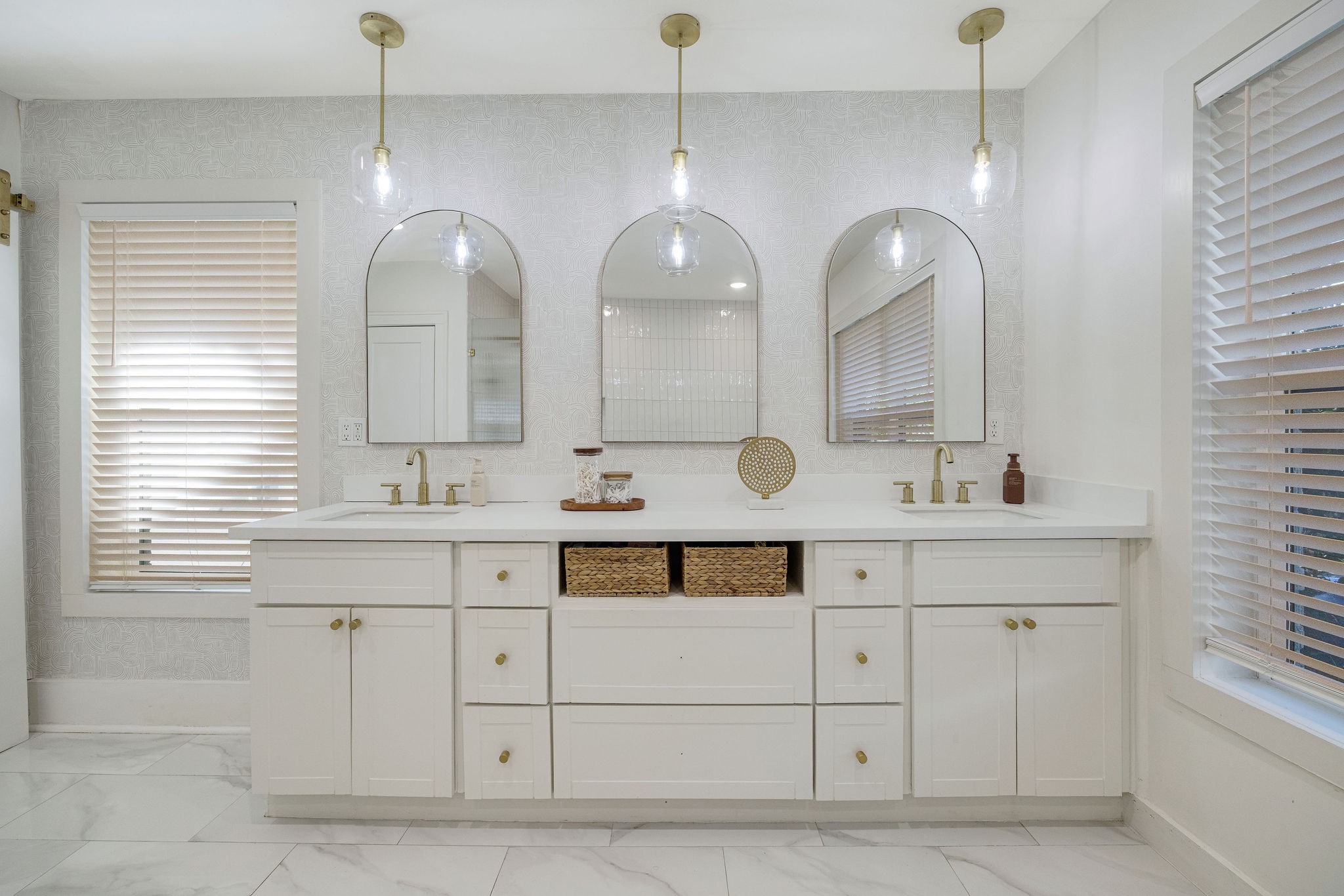 2613 Wichita Street Houston, TX 77004 - Photo 20 of 25 Spa-inspired primary bath with dual sinks, custom cabinetry, quartz countertops, and designer lighting.