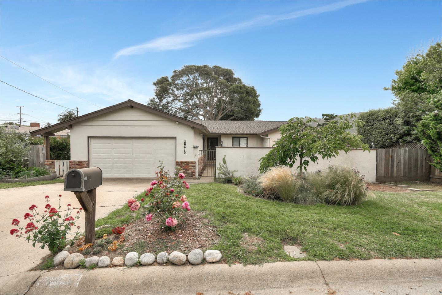 26419 Oliver Road Carmel, CA 93923 - Photo 1 of 35 a front view of a house with garden