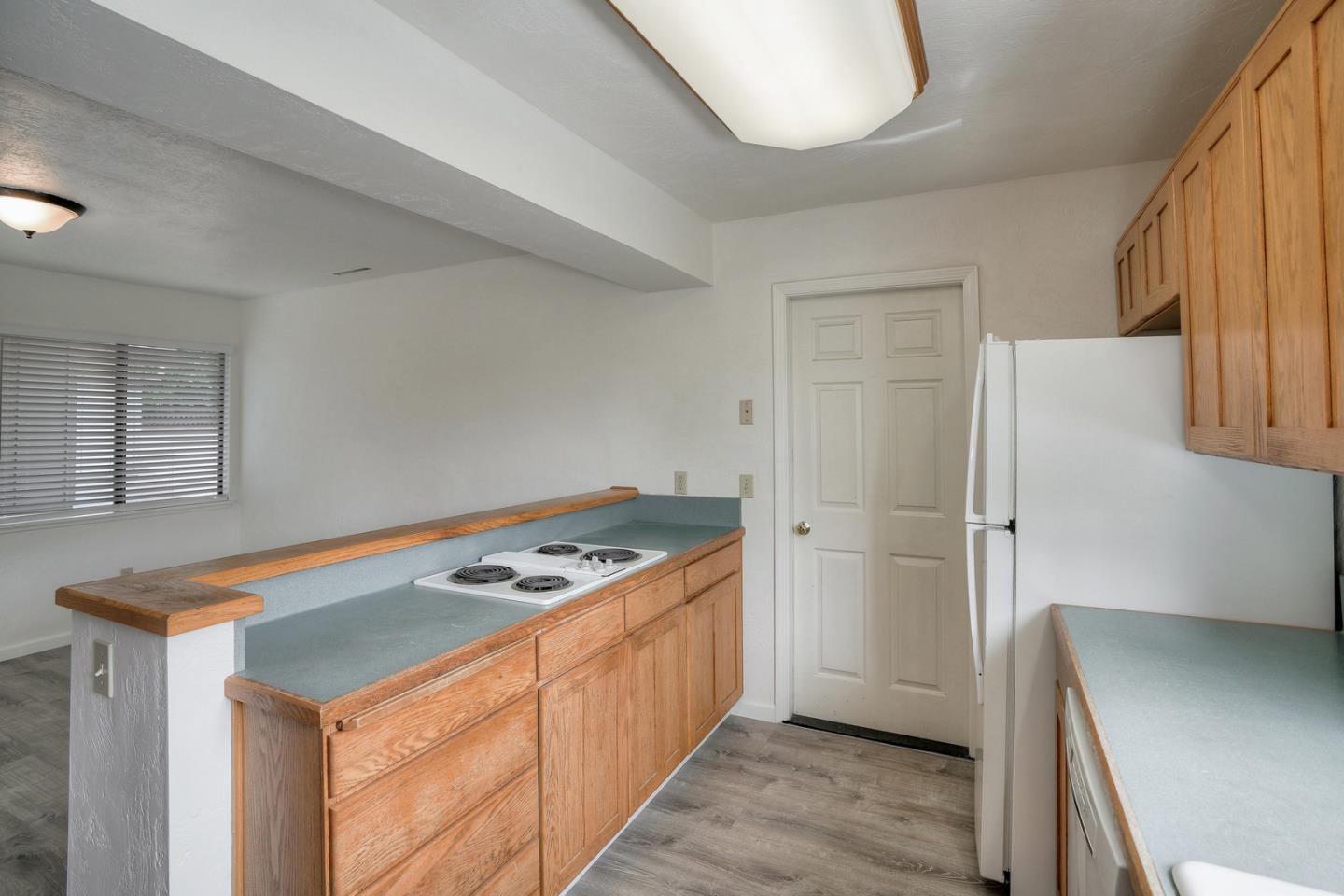 26419 Oliver Road Carmel, CA 93923 - Photo 11 of 35 a kitchen with stainless steel appliances granite countertop a refrigerator and a stove