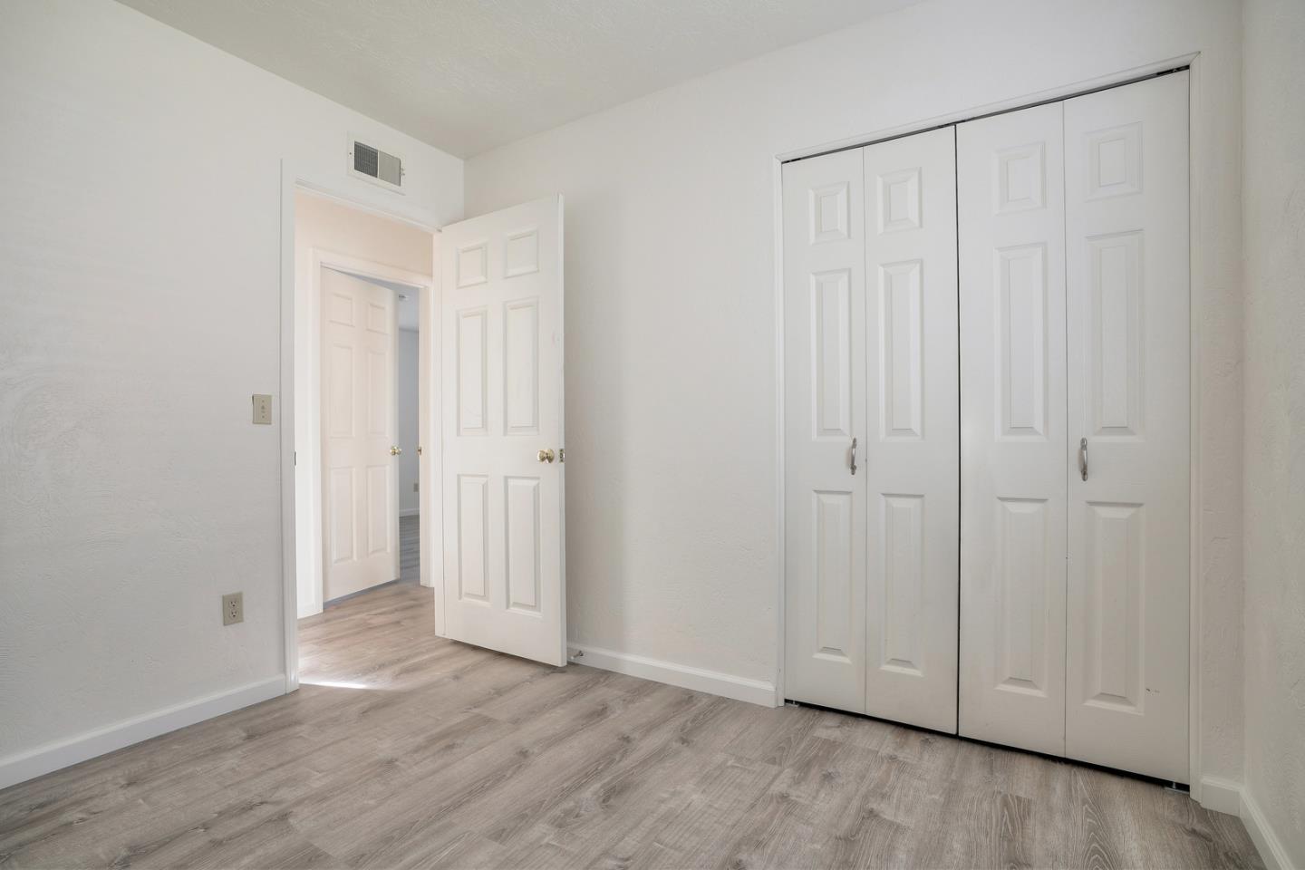 26419 Oliver Road Carmel, CA 93923 - Photo 19 of 35 a view of an empty room with wooden floor