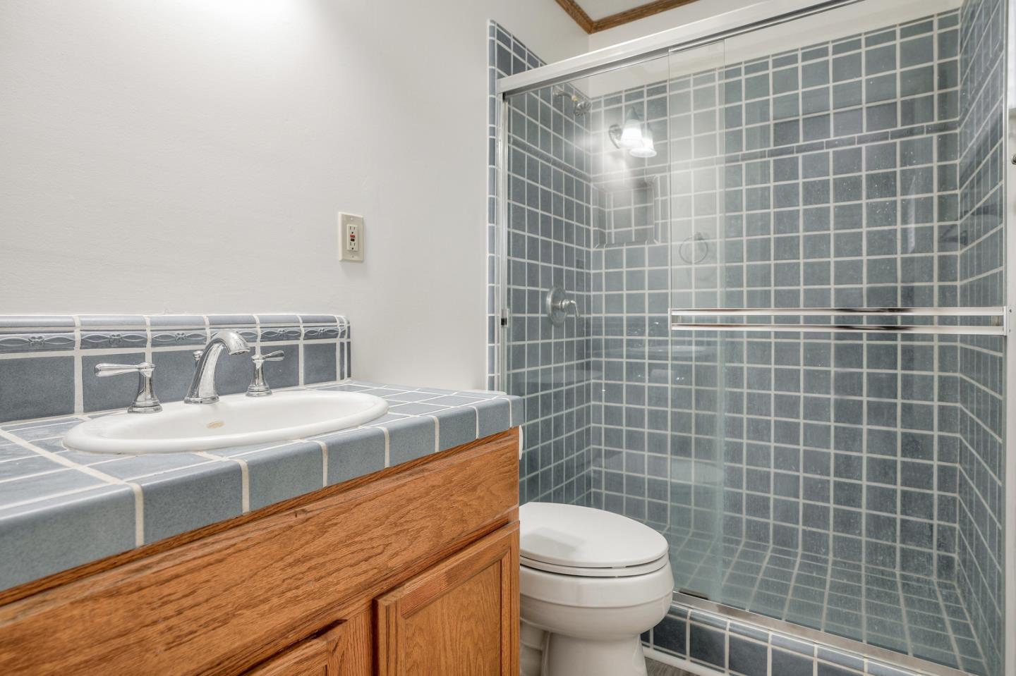 26419 Oliver Road Carmel, CA 93923 - Photo 22 of 35 a bathroom with a sink a toilet and shower