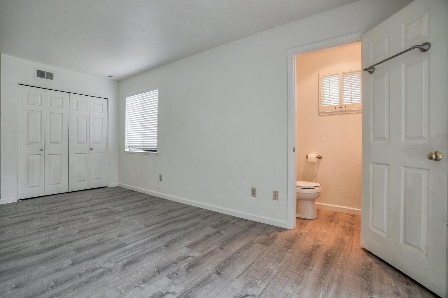 26419 Oliver Road Carmel, CA 93923 - Photo 25 of 35 a view of a room with wooden floor and window