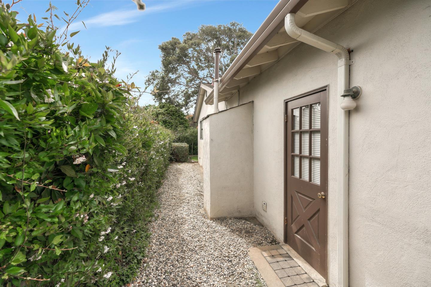 26419 Oliver Road Carmel, CA 93923 - Photo 28 of 35 a view of a house with a yard