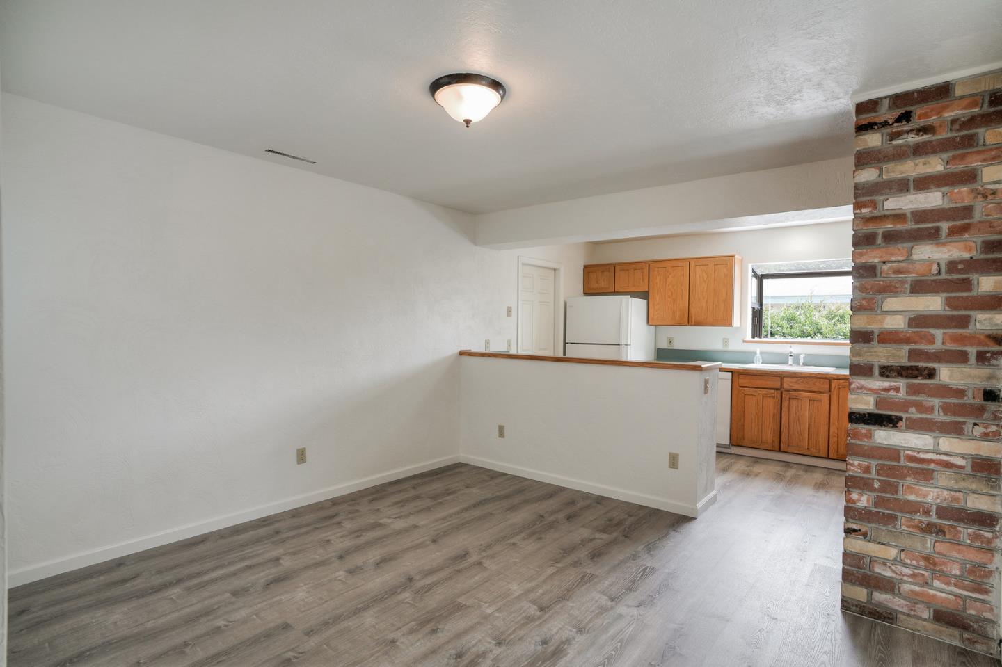 26419 Oliver Road Carmel, CA 93923 - Photo 8 of 35 a view of a kitchen with wooden floor