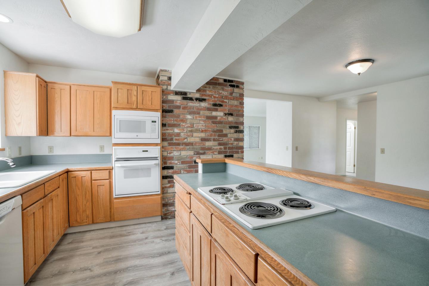 26419 Oliver Road Carmel, CA 93923 - Photo 10 of 35 a kitchen with a stove and a sink