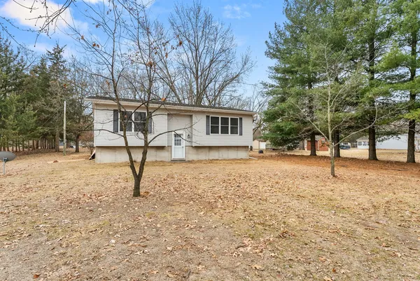 a house with trees in front of it