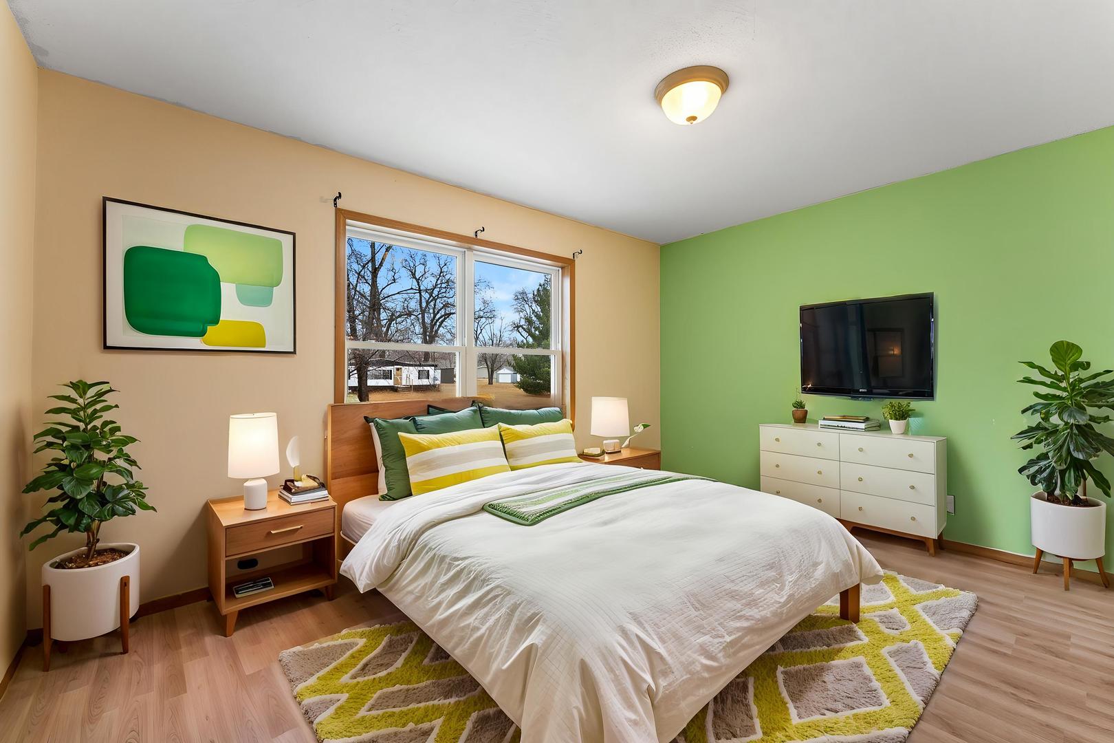 449 83rd Avenue New Boston, IL 61272 - Photo 13 of 25 a bedroom with a bed and a flat screen tv