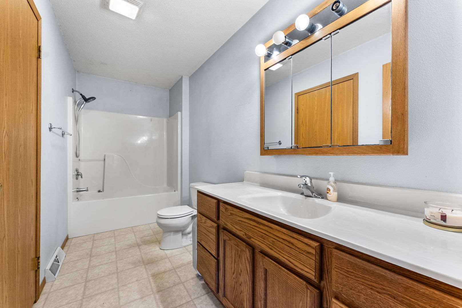 449 83rd Avenue New Boston, IL 61272 - Photo 16 of 25 a bathroom with a sink a toilet and shower