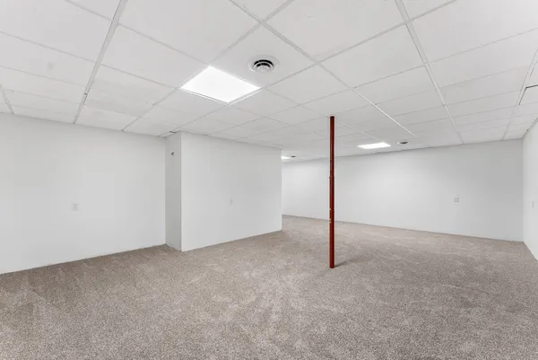 a white toilet sitting next to a shower curtain
