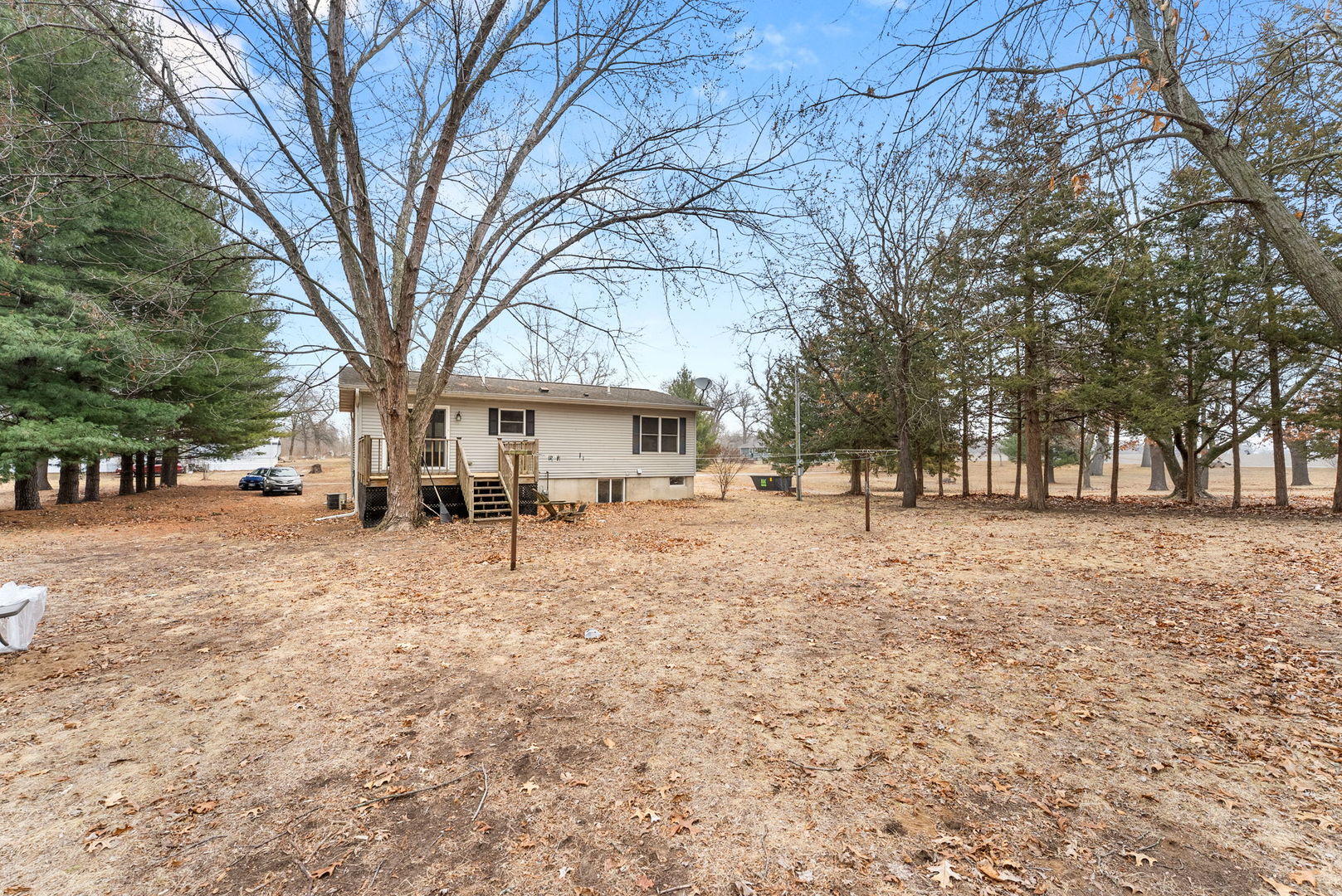449 83rd Avenue New Boston, IL 61272 - Photo 2 of 25 a white house that has a tree in front of it