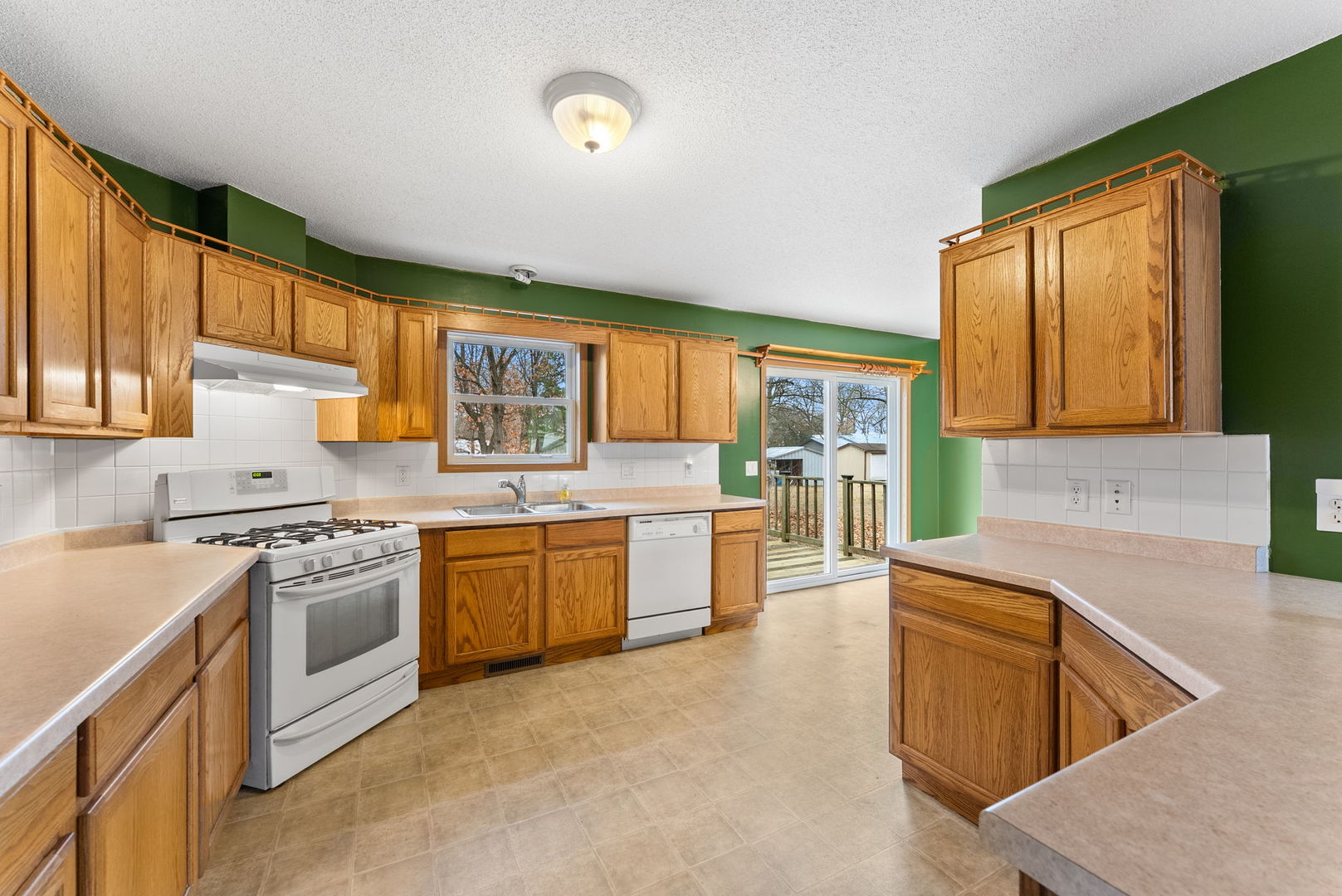 449 83rd Avenue New Boston, IL 61272 - Photo 9 of 25 a large kitchen with stainless steel appliances granite countertop a stove a sink and a microwave