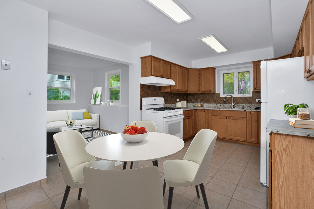 672 Raupp Boulevard Buffalo Grove, IL 60089 - Photo 8 of 26 a kitchen with stainless steel appliances a dining table and chairs