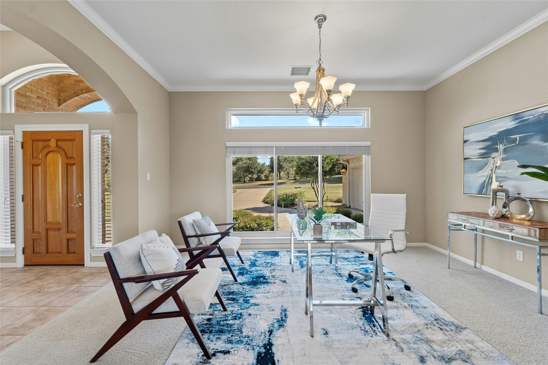 209 Overlook Court Georgetown, TX 78628 - Photo 17 of 34 a living room with furniture and a chandelier