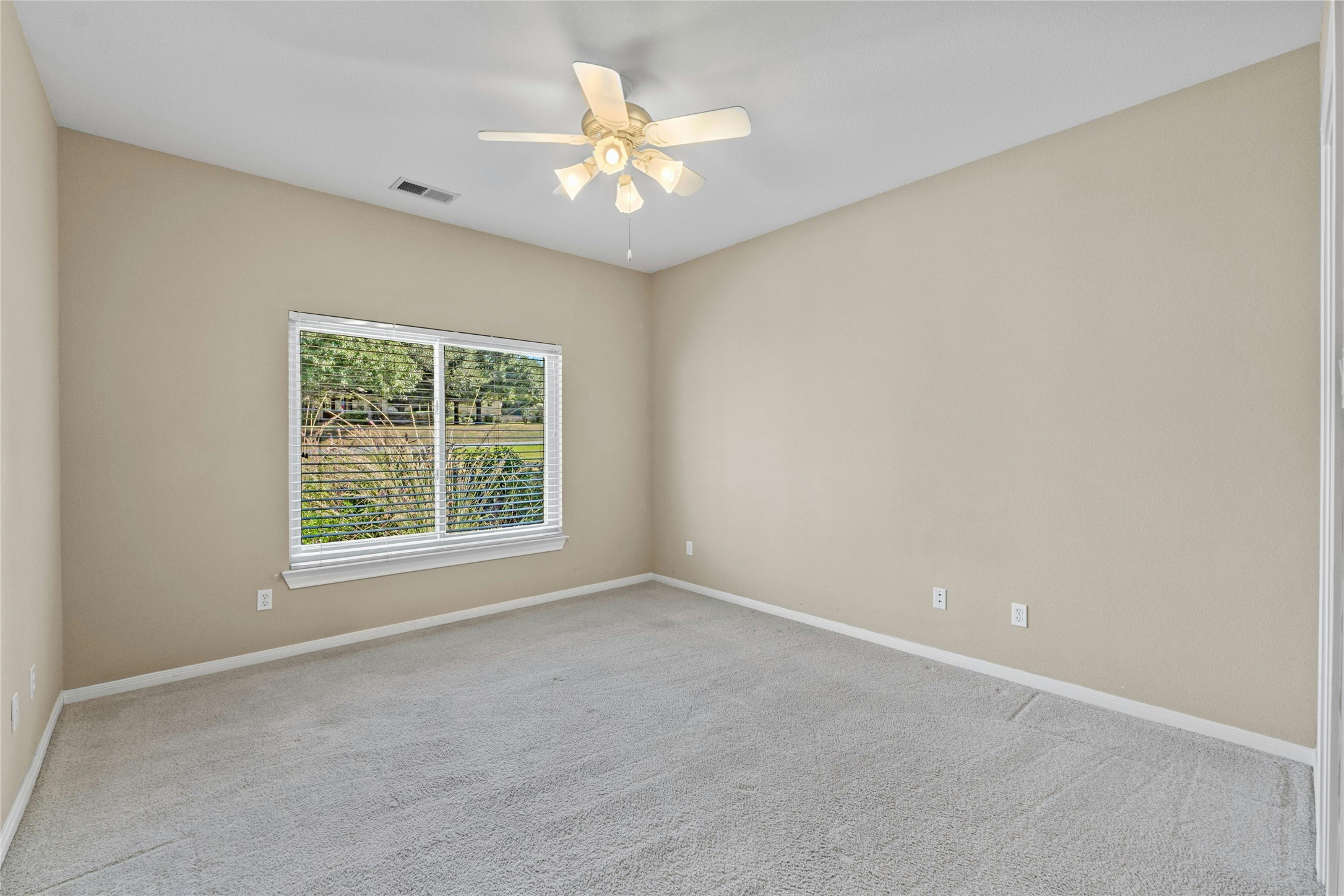 209 Overlook Court Georgetown, TX 78628 - Photo 28 of 34 an empty room with a window and a fan